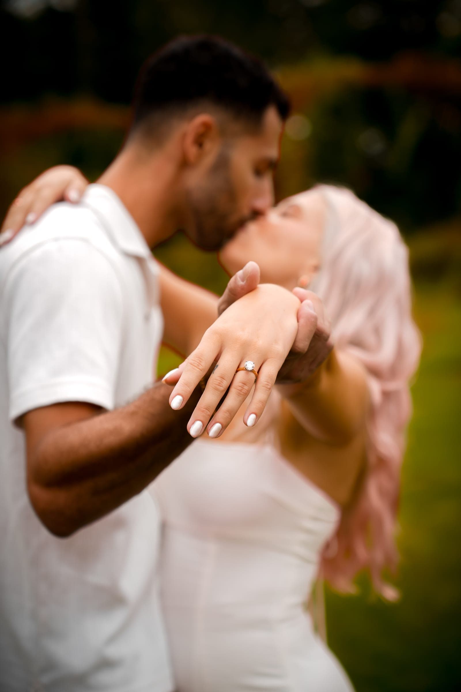 Couple kissing in warm late-summer light